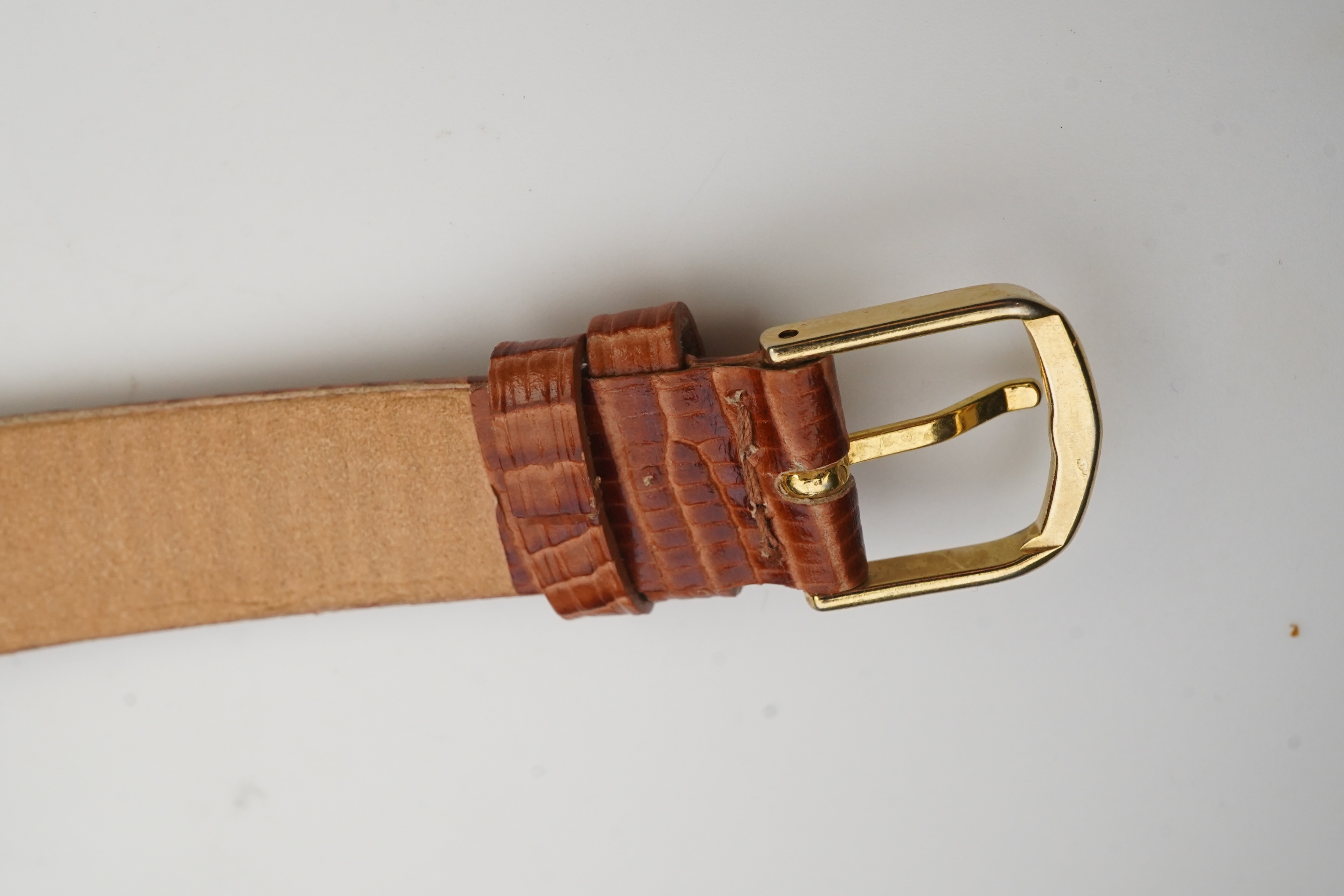 A gentleman's 1950's 10k gold filled Longines manual wind wrist watch, on a later associated leather strap